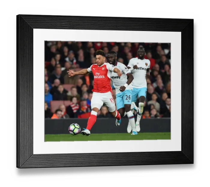Framed Print : Arsenal's Oxlade-Chamberlain Clashes with West Ham's Masuaku in Premier League Showdown Framed Print : Arsenal's Oxlade-Chamberlain Clashes with West Ham's Masuaku in Premier League Showdown