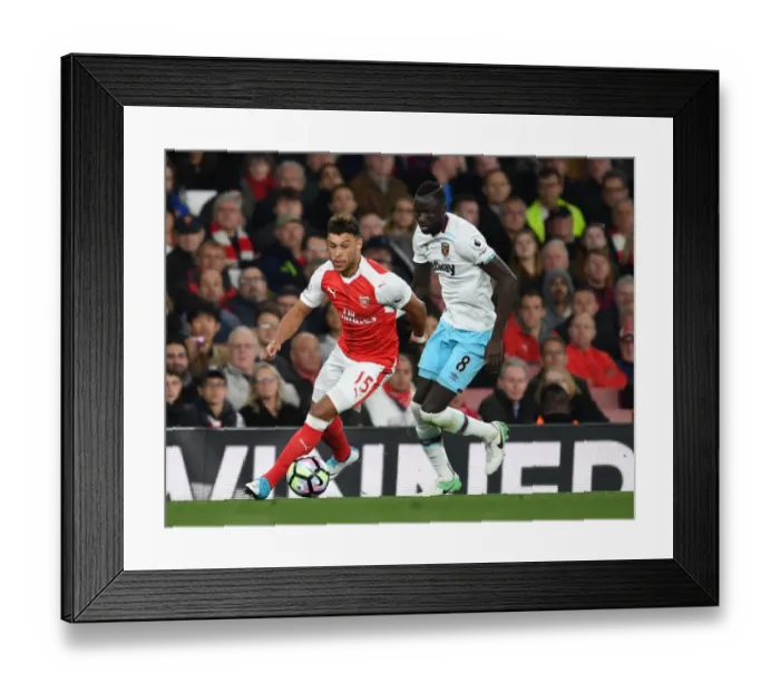 Framed Print : Intense Battle: Oxlade-Chamberlain vs. Kouyate in Arsenal's Premier League Showdown