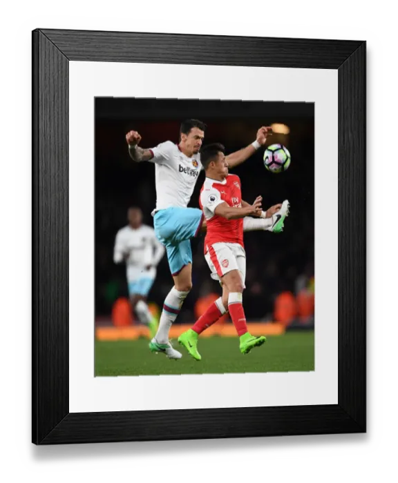 Framed Print : Clash at the Emirates: Sanchez vs Fonte in Arsenal's Battle Against West Ham