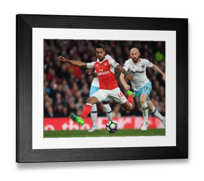 Framed Print : Theo Walcott vs. James Collins: A Premier League Face-Off at Arsenal Framed Print : Theo Walcott vs. James Collins: A Premier League Face-Off at Arsenal