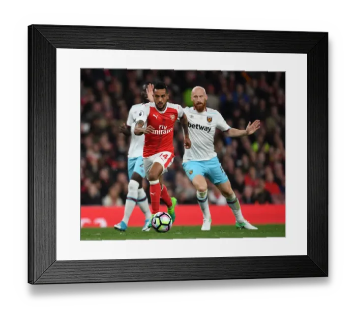 Framed Print : Theo Walcott vs. James Collins: Intense Battle at Arsenal v West Ham United, Premier League 2016-17