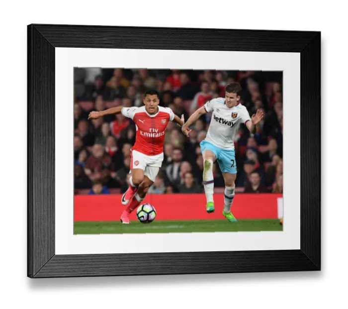 Framed Print : Alexis Sanchez: Agile Star Outmaneuvers Sam Byram during Arsenal's Victory over West Ham Framed Print : Alexis Sanchez: Agile Star Outmaneuvers Sam Byram during Arsenal's Victory over West Ham