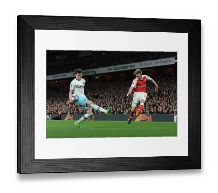 Framed Print : Nacho Monreal (Arsenal) Sam Byram (West Ham). Arsenal 3: 0 West Ham United. Premier League Framed Print : Nacho Monreal (Arsenal) Sam Byram (West Ham). Arsenal 3: 0 West Ham United. Premier League