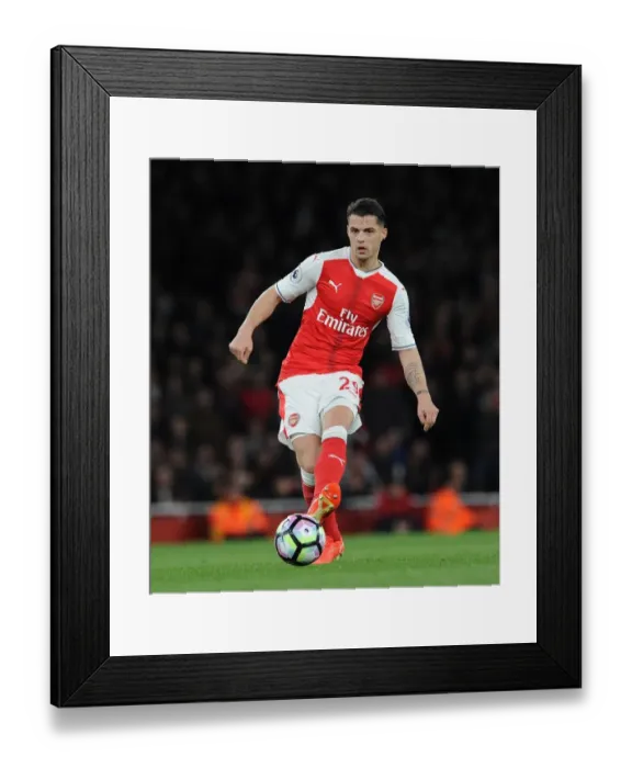 Framed Print : Granit Xhaka (Arsenal). Arsenal 3: 0 West Ham United. Premier League. Emirates Stadium Framed Print : Granit Xhaka (Arsenal). Arsenal 3: 0 West Ham United. Premier League. Emirates Stadium