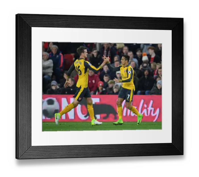 Framed Print : Alexis Sanchez and Rob Holding: United in Victory - Arsenal's First Goal Against Middlesbrough (2016-17) Framed Print : Alexis Sanchez and Rob Holding: United in Victory - Arsenal's First Goal Against Middlesbrough (2016-17)