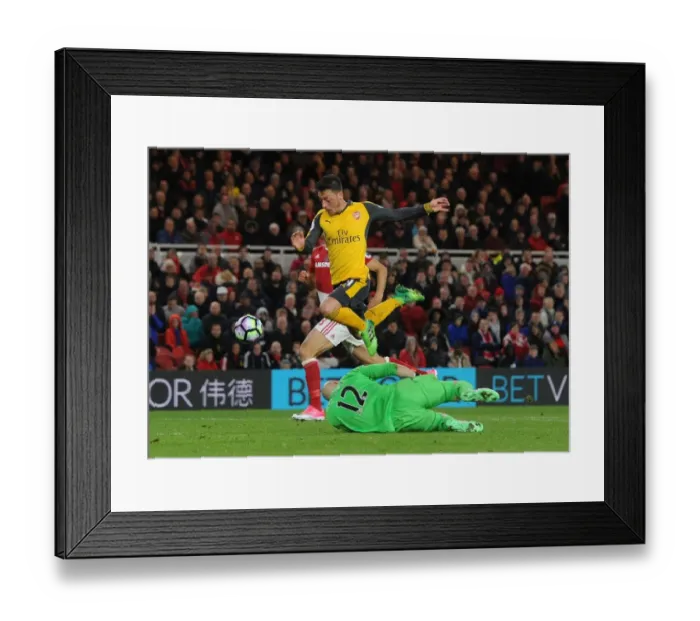 Framed Print : Mesut Ozil vs. Brad Guzan: A Premier League Face-Off at Riverside Stadium