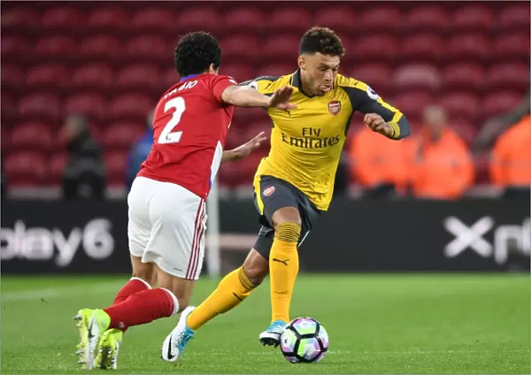 Arsenal's Alex Oxlade-Chamberlain Clashes with Middlesbrough's Fabio in Premier League Showdown