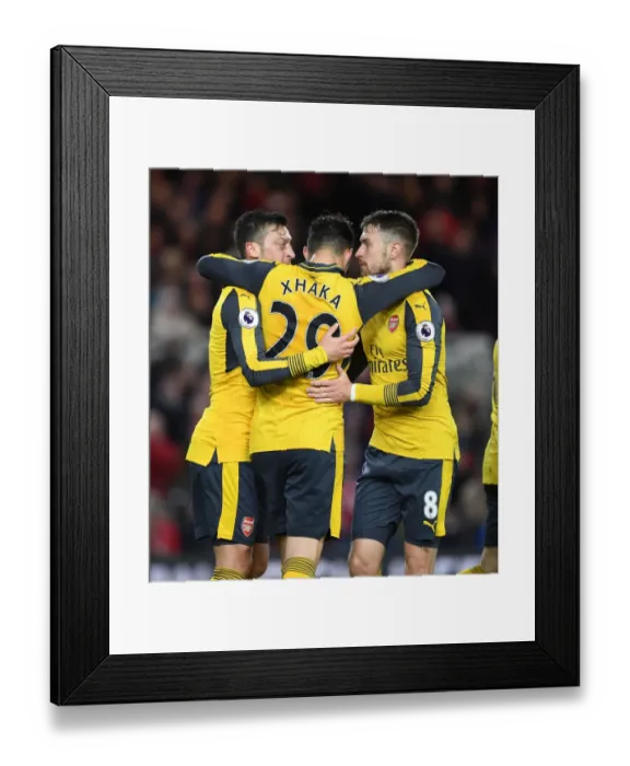 Framed Print : Mesut Ozil, Granit Xhaka, and Aaron Ramsey Celebrate Arsenal's Goals Against Middlesbrough (2016-17)
