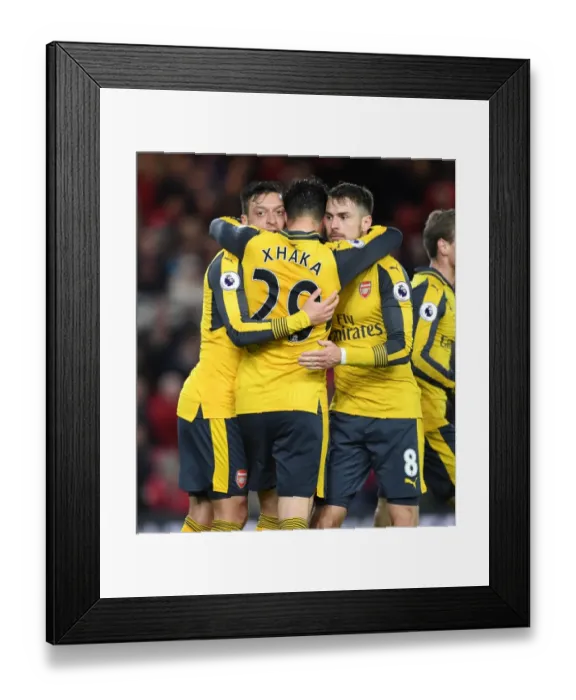 Framed Print : Arsenal's Triumph: Ozil, Xhaka, and Ramsey's Goal Celebration vs. Middlesbrough (2016-17)