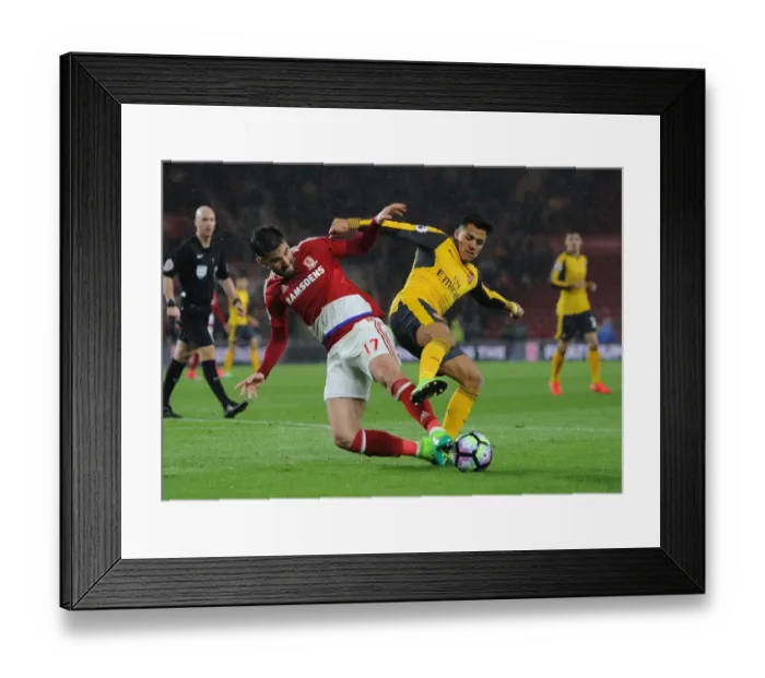Framed Print : Arsenal's Alexis Sanchez Faces Off Against Middlesbrough's Antonio Barragan