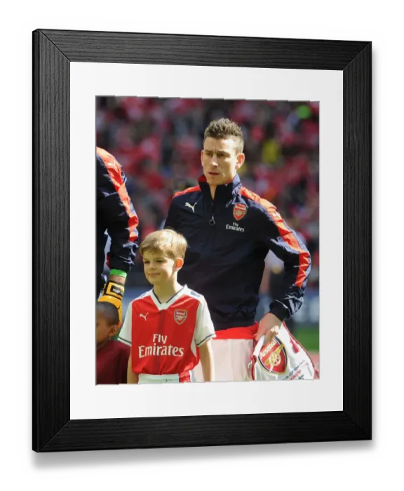 Framed Print : Arsenal's Laurent Koscielny and the Arsenal Mascot Ahead of FA Cup Semi-Final vs. Manchester City Framed Print : Arsenal's Laurent Koscielny and the Arsenal Mascot Ahead of FA Cup Semi-Final vs. Manchester City