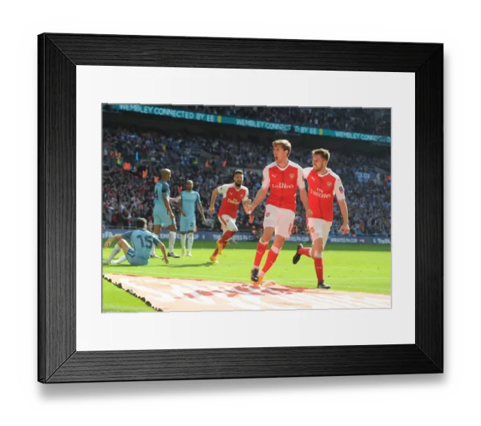 Framed Print : Monreal and Ramsey's Euphoric Moment: Arsenal's FA Cup Semi-Final Goal Against Manchester City