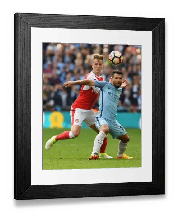 Framed Print : Clash at Wembley: Arsenal's Holding Takes on Manchester City's Aguero in FA Cup Semi-Final Showdown Framed Print : Clash at Wembley: Arsenal's Holding Takes on Manchester City's Aguero in FA Cup Semi-Final Showdown