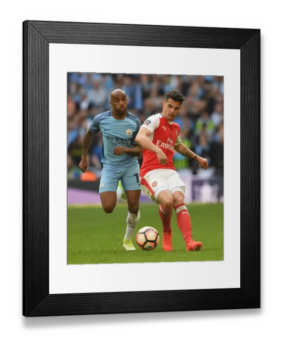 Framed Print : Clash of Midfield Titans: Xhaka vs. Delph - Arsenal vs. Manchester City FA Cup Semi-Final Framed Print : Clash of Midfield Titans: Xhaka vs. Delph - Arsenal vs. Manchester City FA Cup Semi-Final