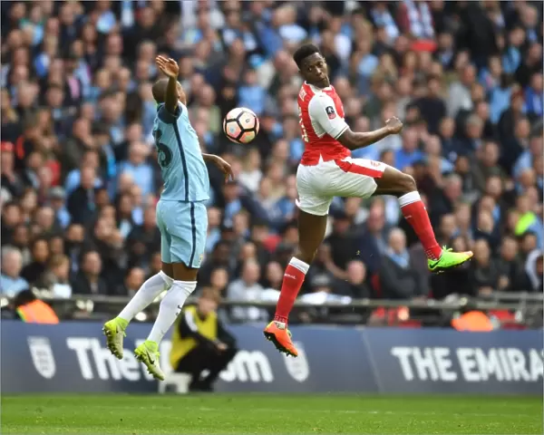 Clash at Wembley: Welbeck Leaps Over Fernandinho in FA Cup Semi-Final Showdown (Arsenal vs Manchester City)
