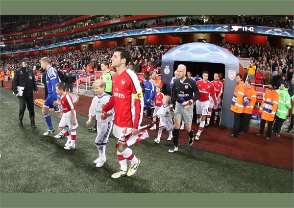 Arsenal captain Cesc Fabregas leads the team out for the first time