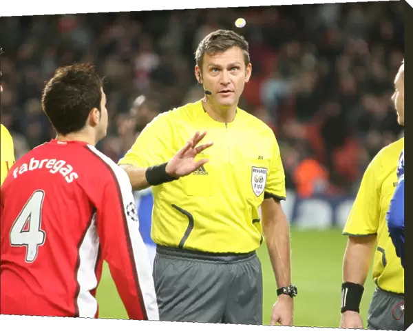 Referee Alain Hamer tosses the coin