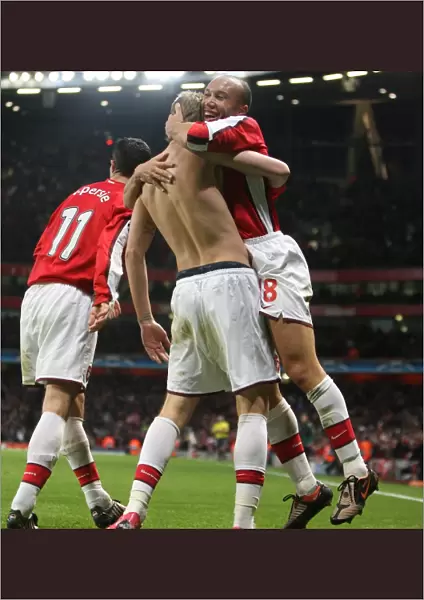 Mikael Silvestre celebrate with goalscorer Nicklas Bendtner