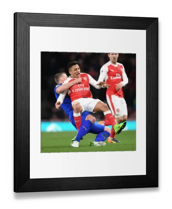 Framed Print : Clash of Titans: Sanchez vs. Huth in Arsenal's Battle Against Leicester City