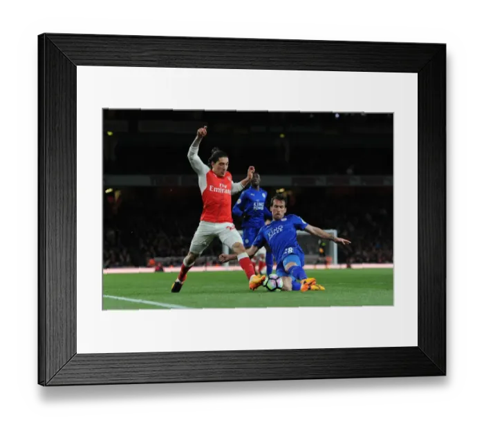 Framed Print : Arsenal's Hector Bellerin Clashes with Leicester's Christian Fuchs in Premier League Showdown