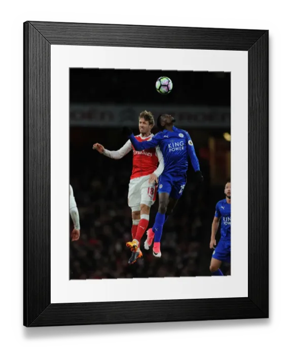 Framed Print : Monreal vs Ndidi: Intense Battle in Arsenal vs Leicester City Premier League Clash