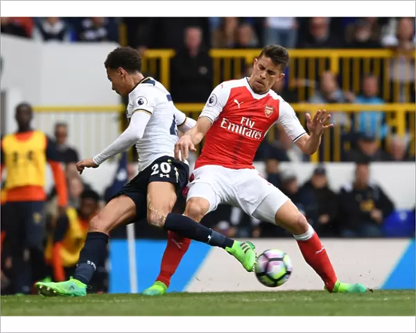 Gabriel vs Dele Alli: Intense Tackle in the Premier League Showdown between Arsenal and Tottenham
