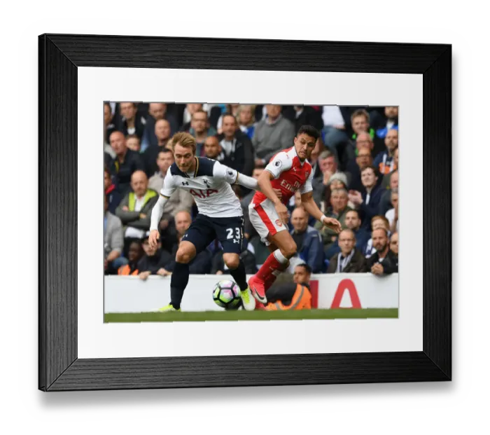 Framed Print : Clash of Stars: Sanchez vs. Eriksen in the Premier League Battle between Tottenham and Arsenal