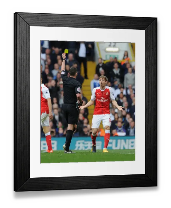 Framed Print : Nacho Monreal Shown Yellow Card by Referee Michael Oliver in Tottenham Hotspur vs Arsenal Premier League Clash Framed Print : Nacho Monreal Shown Yellow Card by Referee Michael Oliver in Tottenham Hotspur vs Arsenal Premier League Clash