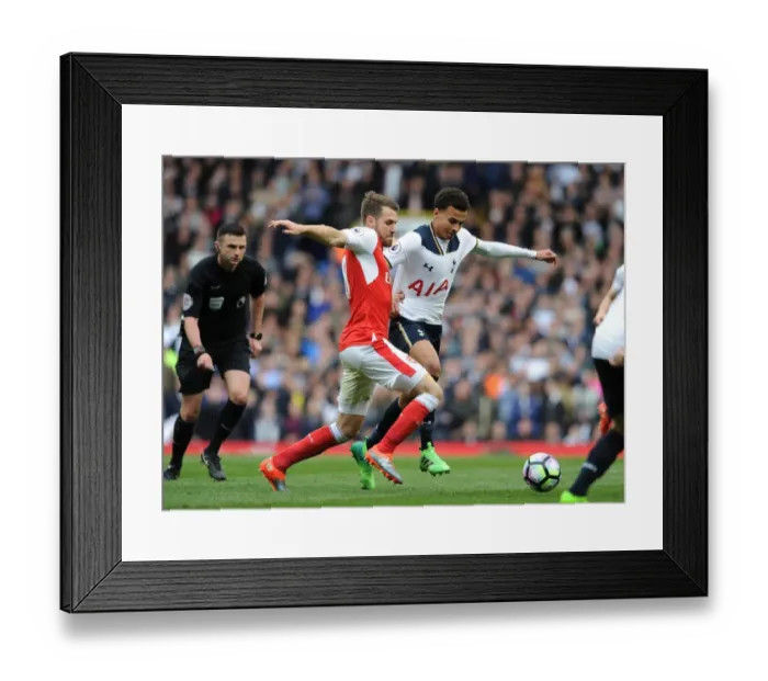 Framed Print : Clash of Midfield Titans: Ramsey vs Alli in the Premier League Battle between Arsenal and Tottenham Framed Print : Clash of Midfield Titans: Ramsey vs Alli in the Premier League Battle between Arsenal and Tottenham
