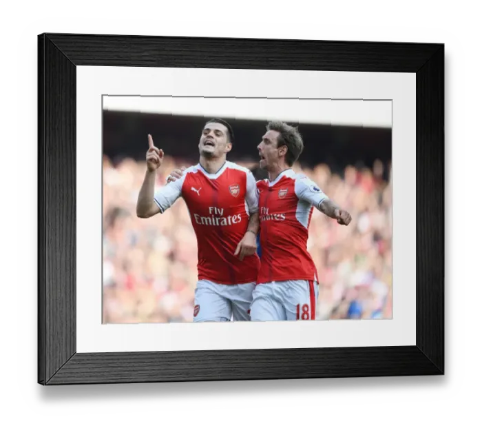 Framed Print : Arsenal's Unforgettable Victory: Xhaka and Monreal's Goal Celebration vs Manchester United (2016-17)