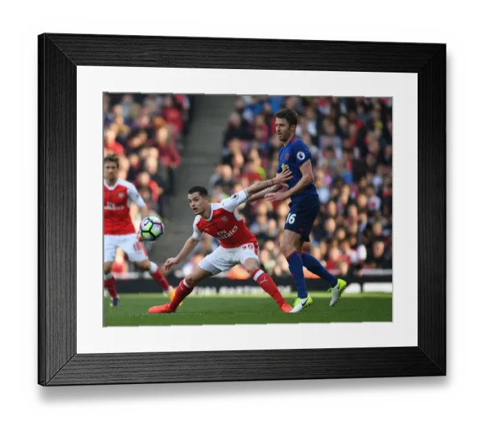 Framed Print : Xhaka vs Carrick: Intense Battle in Arsenal v Manchester United, Premier League 2016-17