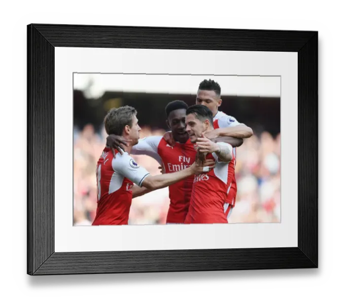 Framed Print : Arsenal's Unlikely Heroes: Xhaka, Gibbs, Monreal, and Welbeck Secure Victory Over Manchester United (2016-17)