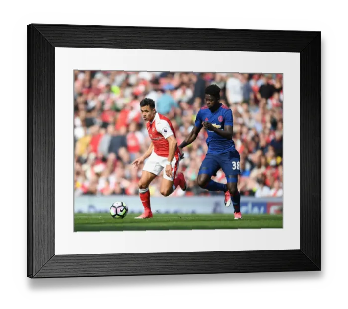 Framed Print : Alexis Sanchez Outsmarts Axel Tuanzebe: Arsenal's Thrilling Premier League Victory Over Manchester United