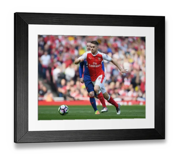 Framed Print : Ramsey's Brilliant Outmaneuver: Arsenal's Star Outsmarts Rooney in Thrilling Premier League Clash (2016-17)