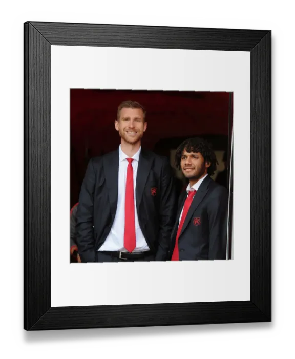 Framed Print : Arsenal: Per Mertesacker and Mohamed Elneny Prepare for Manchester United Clash (2016-17)