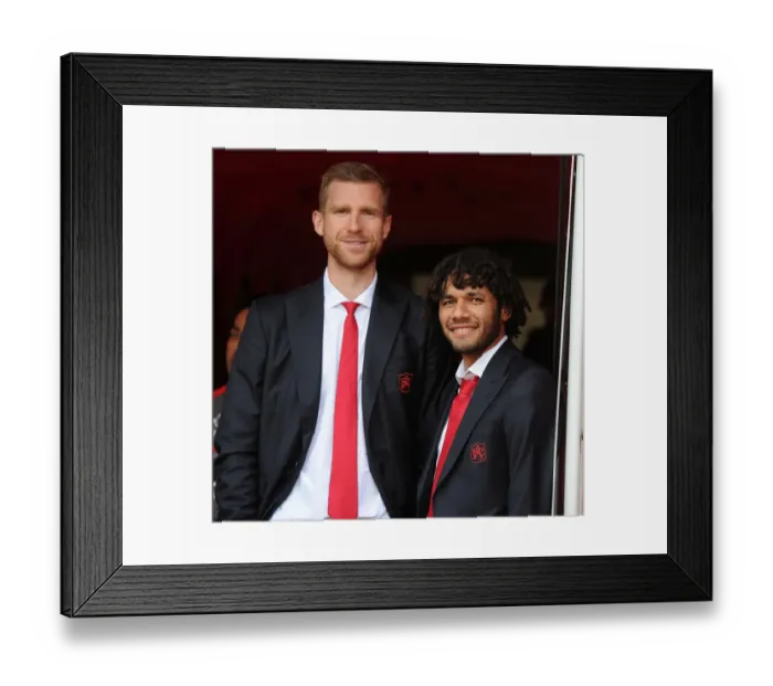 Framed Print : Arsenal Duo: Per Mertesacker and Mohamed Elneny - Focused and Ready for Manchester United Showdown (2016-17)