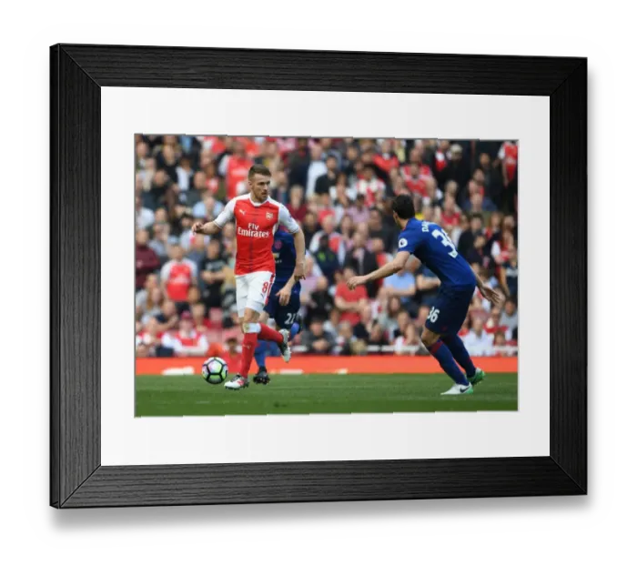 Framed Print : Arsenal's Aaron Ramsey Clashes with Manchester United's Matteo Darmian in Premier League Showdown Framed Print : Arsenal's Aaron Ramsey Clashes with Manchester United's Matteo Darmian in Premier League Showdown