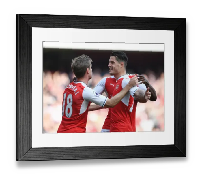 Framed Print : Arsenal's Unforgettable Goal Celebration: Xhaka and Monreal's Emotional Moment vs. Manchester United (2016-17)