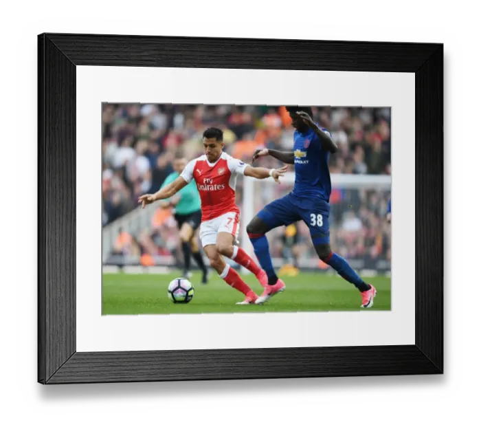 Framed Print : Clash of Stars: Sanchez vs. Tuanzebe in Arsenal vs. Manchester United Showdown Framed Print : Clash of Stars: Sanchez vs. Tuanzebe in Arsenal vs. Manchester United Showdown