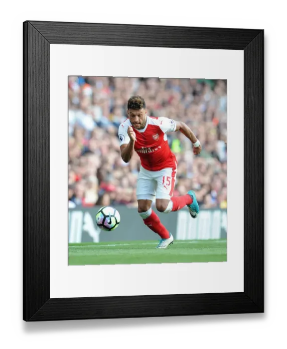 Framed Print : Arsenal's Alex Oxlade-Chamberlain Faces Off Against Manchester United in Premier League Showdown Framed Print : Arsenal's Alex Oxlade-Chamberlain Faces Off Against Manchester United in Premier League Showdown