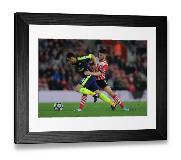 Framed Print : Intense Battle: Coquelin vs Long - Premier League Showdown