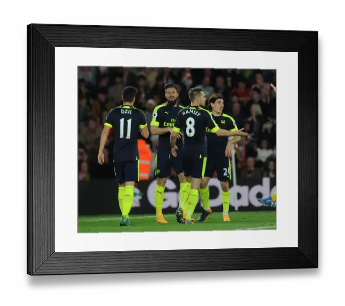 Framed Print : Arsenal's Winning Moment: Giroud, Ozil, Ramsey, and Bellerin Celebrate Goals Against Southampton (2016-17)