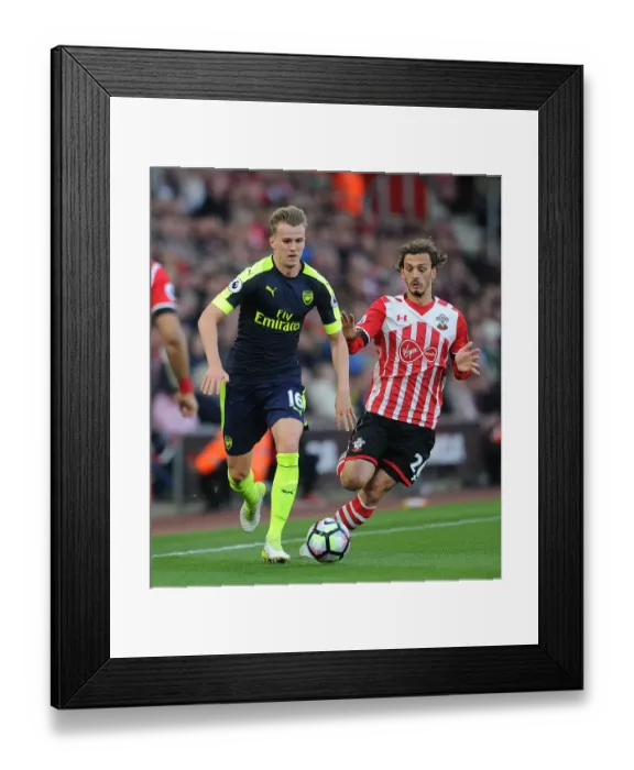 Framed Print : Clash of Titans: Holding vs. Gabbiadini - A Battle for Premier League Supremacy (Southampton vs. Arsenal, 2016-17)