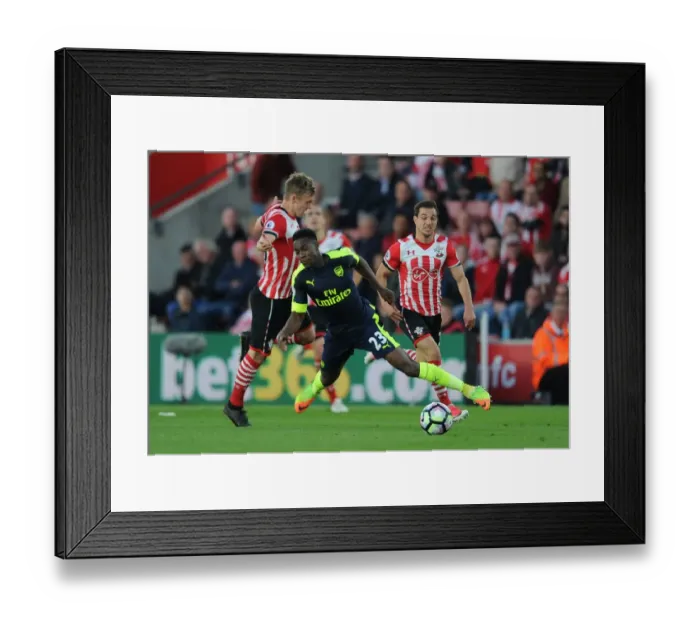 Framed Print : Intense Rivalry: Welbeck vs Ward-Prowse - Southampton vs Arsenal Clash: A Battle on the Field