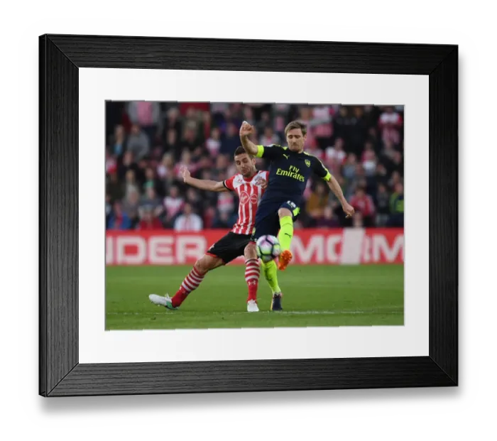 Framed Print : Clash at St. Mary's: Monreal vs. Tadic in Southampton v Arsenal Premier League Showdown