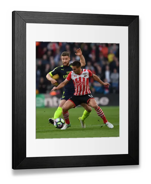 Framed Print : Mustafi vs. Tadic: Intense Clash Between Southampton and Arsenal Players