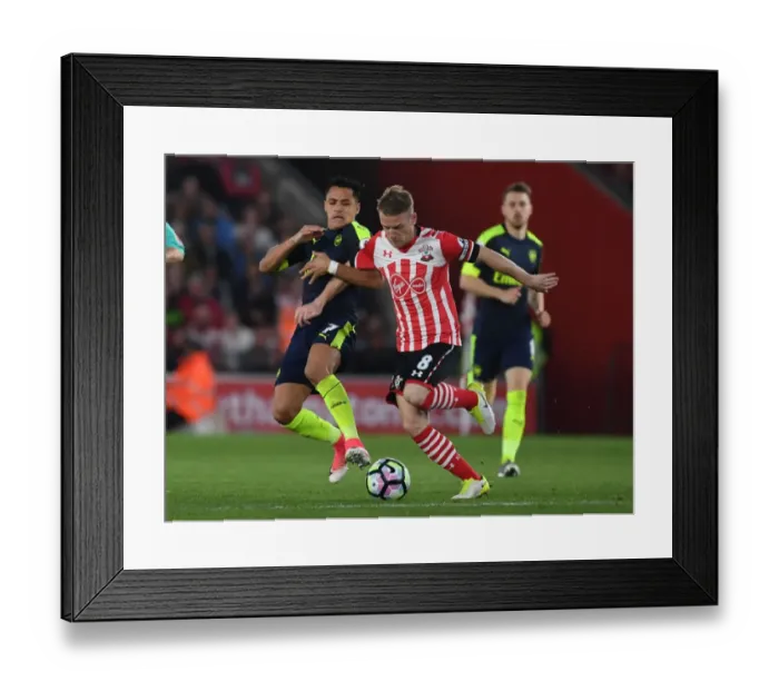 Framed Print : Clash at St. Mary's: Alexis Sanchez vs. Steven Davis in Premier League Showdown