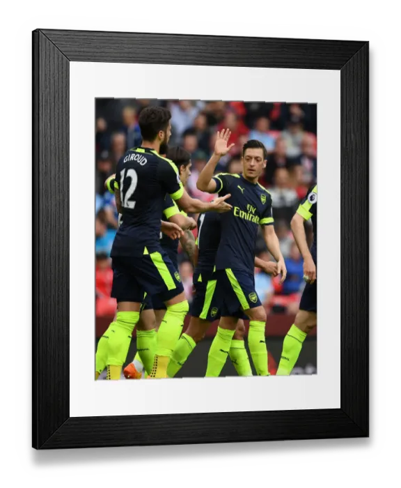Framed Print : Olivier Giroud and Mesut Ozil Celebrate Arsenal's Goal Against Stoke City, 2016-17 Season Framed Print : Olivier Giroud and Mesut Ozil Celebrate Arsenal's Goal Against Stoke City, 2016-17 Season