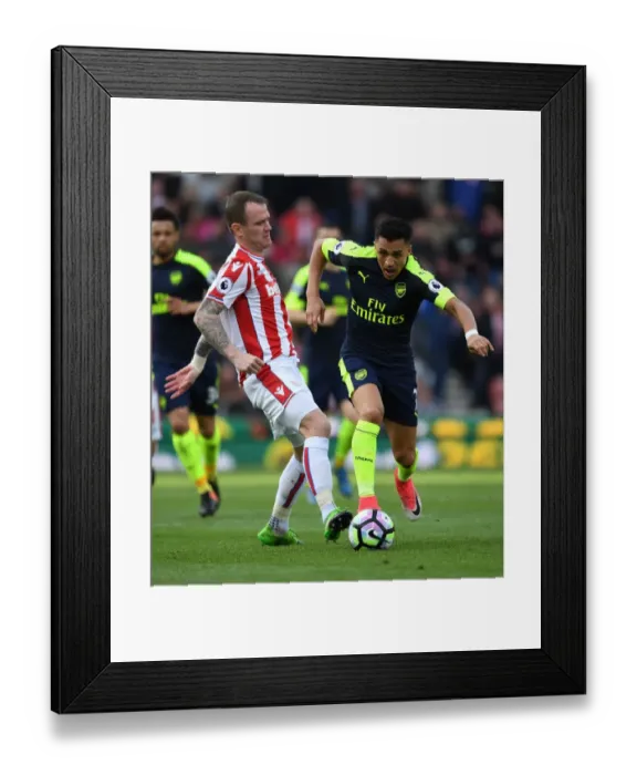 Framed Print : Alexis Sanchez vs. Glenn Whelan: Intense Battle at Stoke City vs. Arsenal (Premier League, 2016-17)