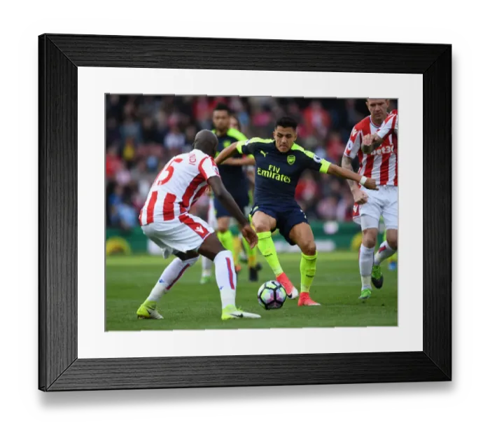 Framed Print : Clash of Forces: Sanchez vs. Martins Indi - Stoke City vs. Arsenal, Premier League Framed Print : Clash of Forces: Sanchez vs. Martins Indi - Stoke City vs. Arsenal, Premier League